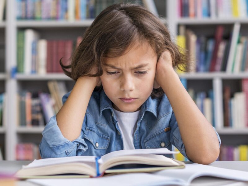 front-view-boy-thinking-hard-about-how-solve-his-homework-min front-view-boy-thinking-hard-about-how-solve-his-homework-min